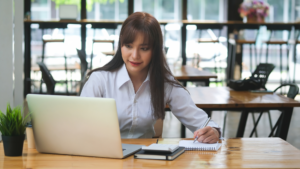 Accounting professional working on laptop to boost local visibility