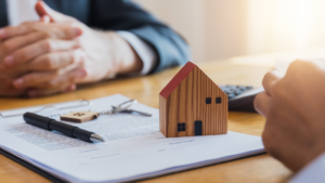 Agent finalizing local real estate listing paperwork with client