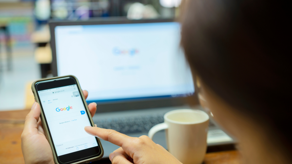 Business owner about to review profile updates on mobile and desktop