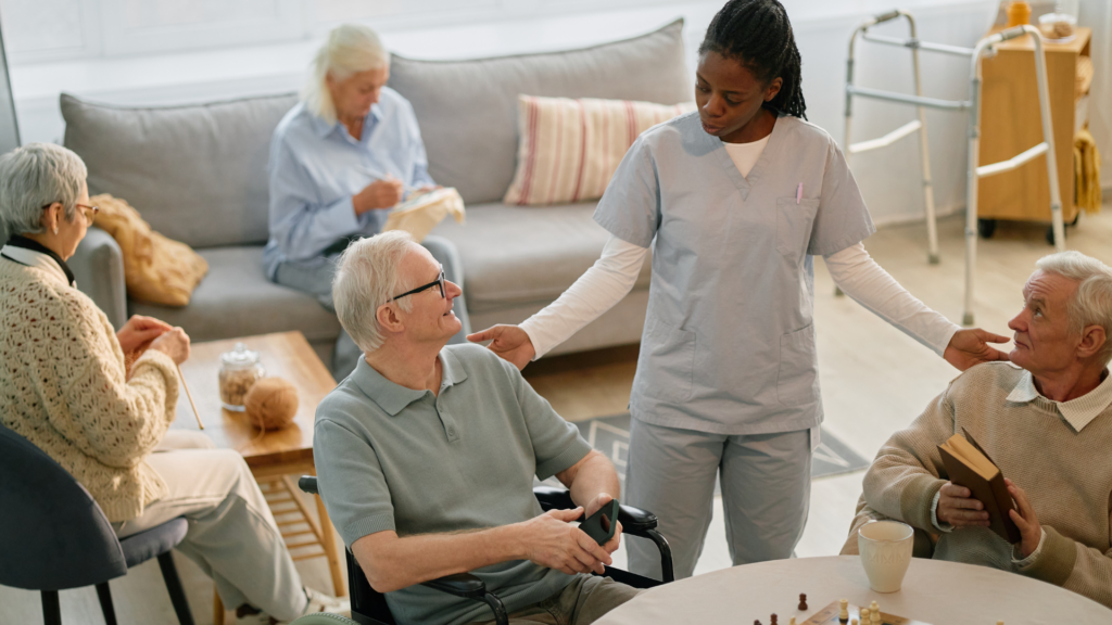 Chiropractor engaging with senior patients during a community visit