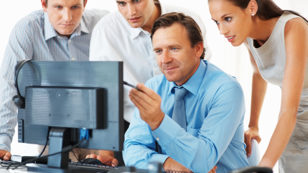 Coworkers discussing consistent SEO efforts during team strategy meeting