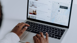 Laptop displaying nearby business listings with map view