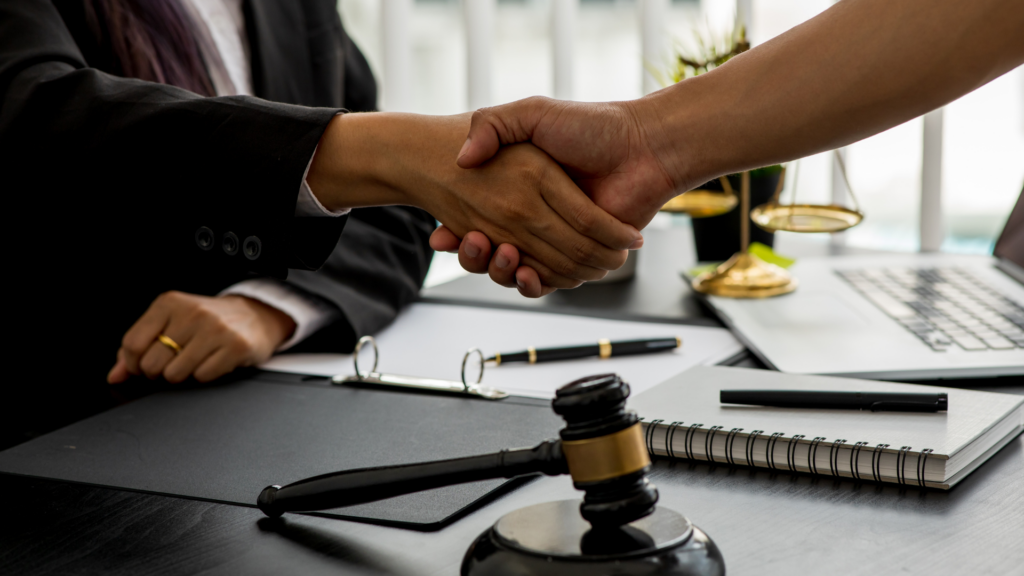 Law firm client handshake representing trust built through online visibility
