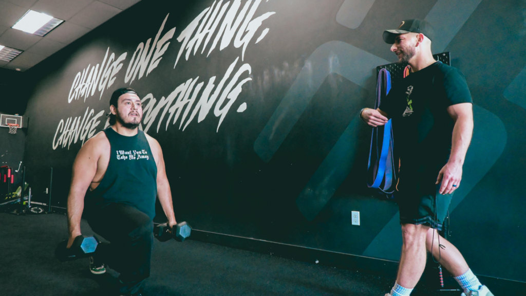 Local gym members staying motivated during a strength training session