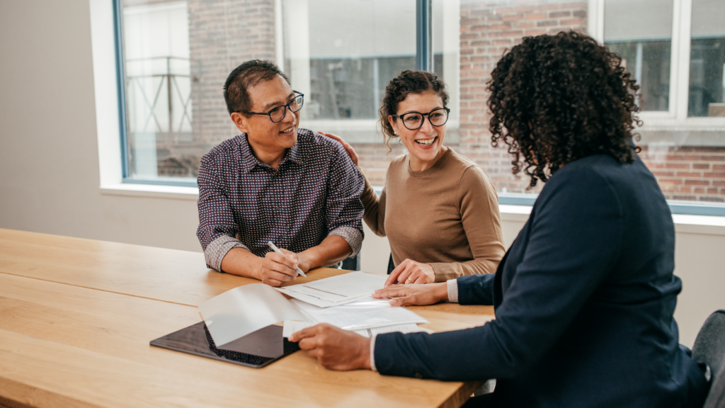 Real estate agent discussing local listing details with clients