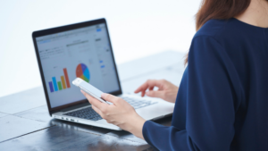 Woman reviewing SEO data and analytics on multiple devices