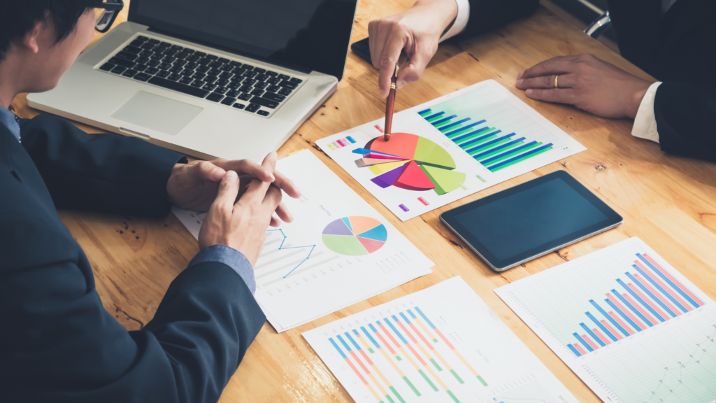 Advisors reviewing performance charts to strengthen client trust and reputation