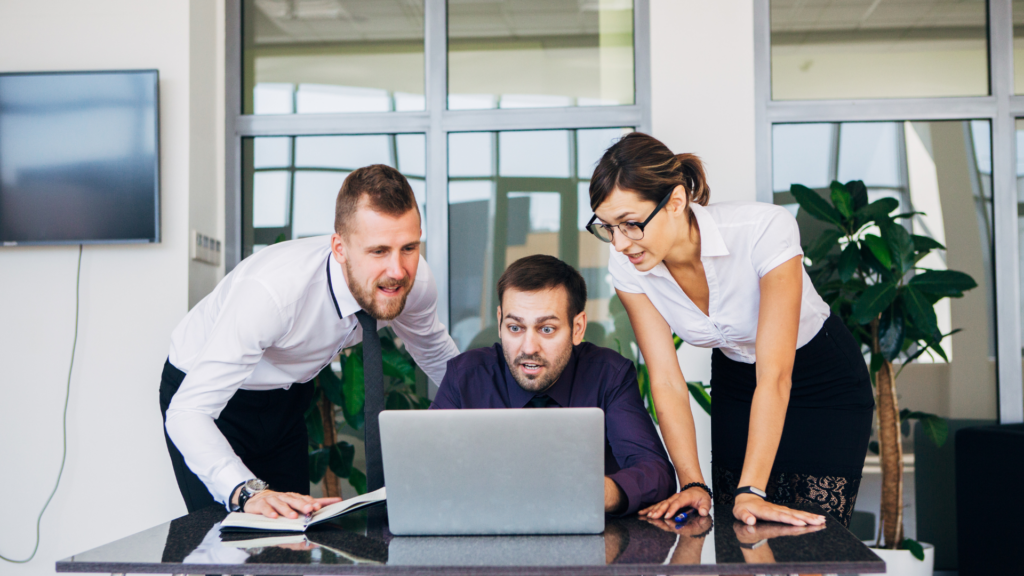 Colleagues discussing customer reviews to improve conversion rates
