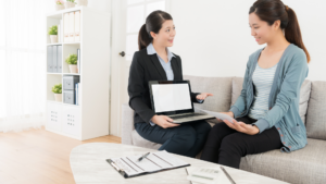Insurance professional walking a client through policy information in person