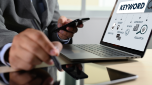 Keyword research diagram shown on laptop with smartphone nearby