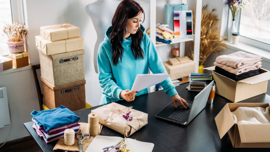Small business owner reviewing details before shipping customer orders