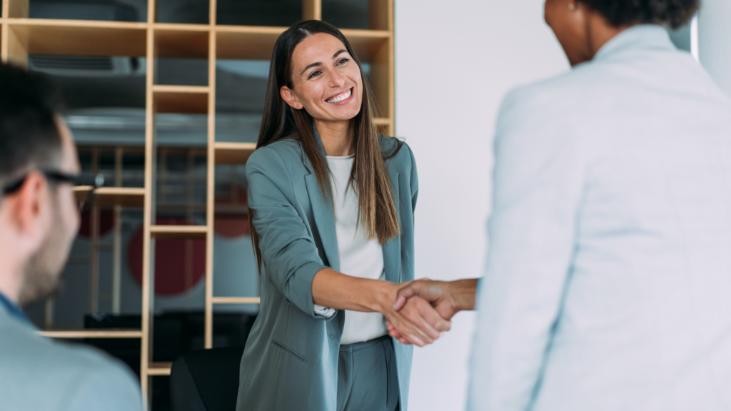 Two local business owners confirming a community partnership deal
