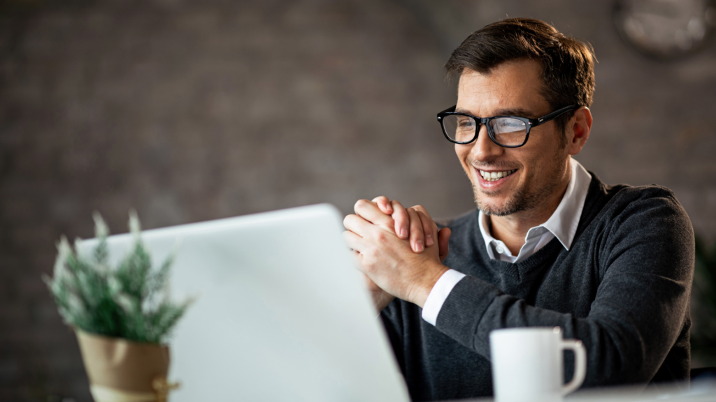 Business owner pleased with local search coverage shown on his laptop
