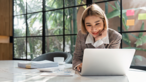 Business owner running a local SEO audit on a laptop with reports