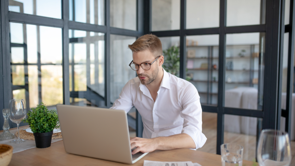 Marketer working on a laptop to update property content online