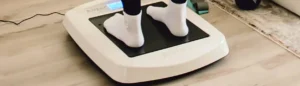 person using a Juvent vibration plate